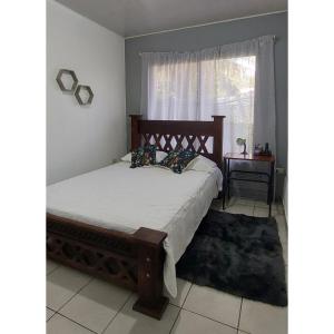 Tempat tidur dalam kamar di Casa Coco