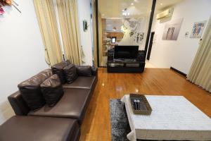 Posezení v ubytování ปุณณภา พูล วิลล่า พัทยา Punnapha Pool Villa Pattaya