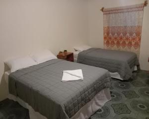 Postel nebo postele na pokoji v ubytování Chill House Flores