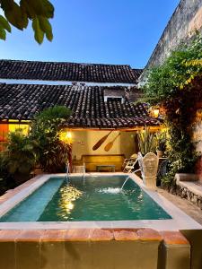 a swimming pool in the backyard of a house at CASA SINNING-año1637 in Mompos