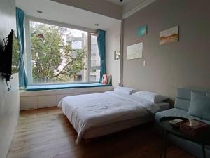 Katil atau katil-katil dalam bilik di 東海小時光 Tong Hai Time Homestay