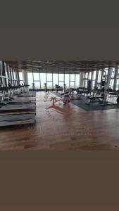 a gym with a large room with tables and chairs at SuteraMuslimOnlyHomestay Bali Residence Melaka in Melaka +3 photos