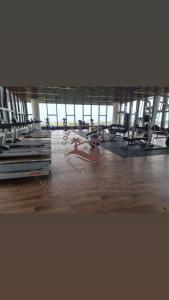 a gym with a large room with tables and chairs at SuteraMuslimHomestay Bali Residence Melaka in Melaka