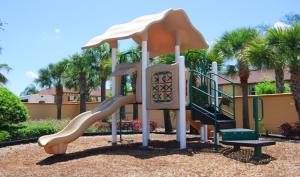 a playground with a slide in a park at Townhouse in Regal Palms Resort, Amenities, Pool & lazy river, Near Disney, Orlando in Davenport