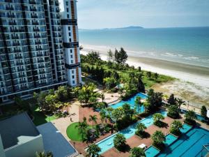 a view of the beach from the balcony of a building at VitaminSEA2 Seaview 6PAX Studio Netflix A-9-16 in Kampung Saberang Balok