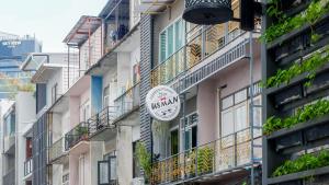 a building with a sign on the side of it at Usman Halal Home in Bangkok