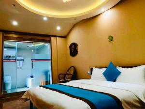 Ένα ή περισσότερα κρεβάτια σε δωμάτιο στο Juxian Boutique Homestay