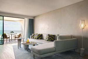a living room with a couch and a table at W Algarve in Albufeira