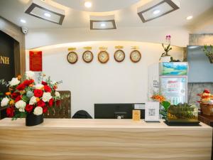 a cashier counter in a store with flowers on it at Le Tuan Minh Hotel in Da Lat