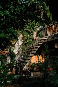 a staircase in a garden with a bunch of plants at TỊNH Retreat Phu Quoc in Phú Quốc