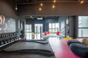 a room with a gym with a lot of balls at Blissful Cottage@FeelHome/2BR,7pax,MRT 中文房东 in Kuala Lumpur