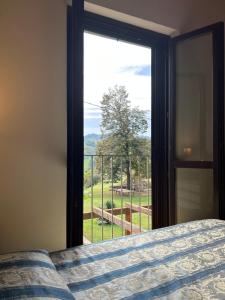 Voodi või voodid majutusasutuse Nutrilamente country house toas