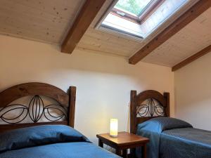 Voodi või voodid majutusasutuse Nutrilamente country house toas