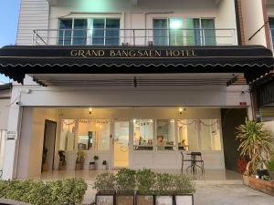 a grand bang saayan hotel with awning on a building at Grand Bangsaen Hotel in Bangsaen