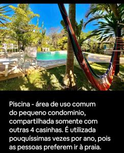una hamaca está atada a un árbol cerca de una piscina en Quinta do Moçambique, en Florianópolis