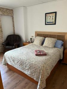 a bedroom with a bed with a purse on it at Vivienda turística ondara in Ondara