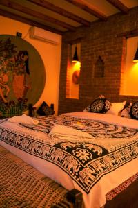 Ένα ή περισσότερα κρεβάτια σε δωμάτιο στο Sapana Village Lodge