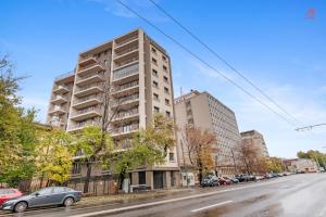 an apartment building on a city street with cars parked at Apartament Opera Residence - Cismigiu, Eroilor, Free Private Parking in Bucharest
