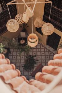 an overhead view of a living room with hanging baskets at Dar Tuscia in Marrakech