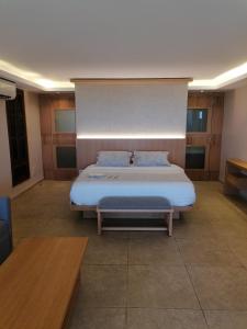 a bedroom with a large bed in a room at Laguava Resort in Ar Rumaylah