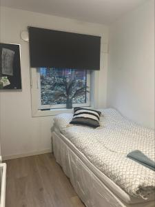 Tempat tidur dalam kamar di Gamle Oslo Apartments