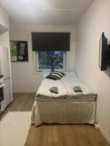Tempat tidur dalam kamar di Gamle Oslo Apartments