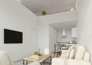 a living room with a couch and a table at Ascot House Apartments in Peterborough