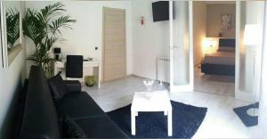 a living room with a couch and a table at B&B Crystal in Messina
