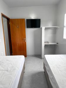 Cama o camas de una habitación en Spot Hotel e pousada