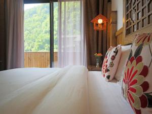 Katil atau katil-katil dalam bilik di Zhangjiajie One city one inn