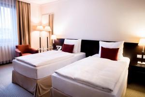 Posteľ alebo postele v izbe v ubytovaní Crowne Plaza Bratislava by IHG
