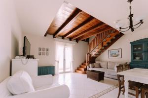 a living room with a couch and a table at Hotel Abalone in Crikvenica +213 photos