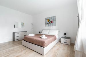 En eller flere senge i et værelse på Guerrazzi New Flat - Parcheggio privato