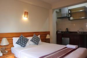 Postel nebo postele na pokoji v ubytování Subha Casa Hotel