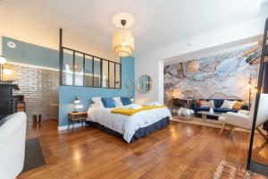 a bedroom with a large map on the wall at La Demeure Numéro 5 in Cambrai