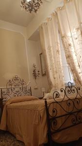 سرير أو أسرّة في غرفة في Relais Corso Storico