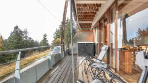 a bike parked on the balcony of a house at V du Bachat EPICEA C02 - Appt 5 pers in Chamrousse