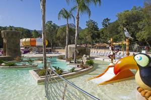 a water park with a slide in the water at Camping Bella Vista in Calvi