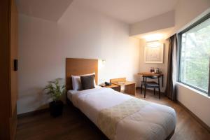Postel nebo postele na pokoji v ubytování HOTEL LE ROYCE + 22 fotografií
