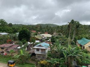 a village with houses and trees and a train at ZL TRAVELERS INN in Batuan