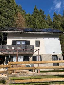 a house with solar panels on the roof at Apartments Nune 2 in Zreče