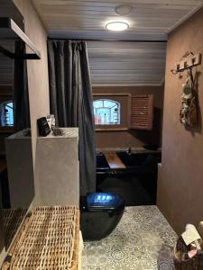a room with two beds and a desk and a window at Landgoed de Bongel in De Wijk