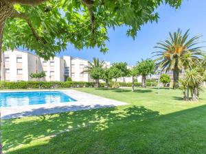 an image of a swimming pool in a park with trees at 0326 Apartment in Calella de Palafrugell in Calella de Palafrugell