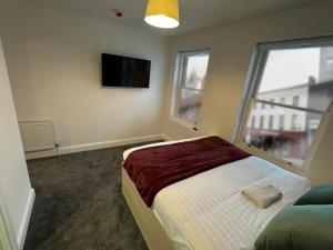 Postel nebo postele na pokoji v ubytování Mary Mullen's Rooms Eyre Square.