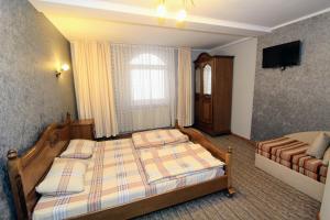 Postel nebo postele na pokoji v ubytování Затишний міні-готель "Rosky"
