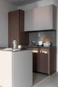 Η κουζίνα ή μικρή κουζίνα στο Portopiccolo Apartments - Perla nel borgo