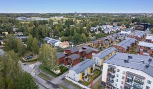 an aerial view of a town with houses at Private room in the shared detached house. in Vantaa