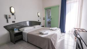 Postel nebo postele na pokoji v ubytování Hotel Nobel - Soft All Inclusive