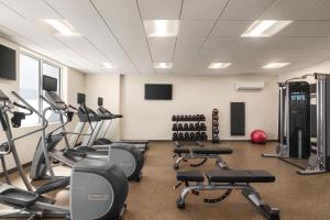 a gym with several treadmills and exercise bikes at Hilton Garden Inn San Antonio Downtown Riverwalk in San Antonio