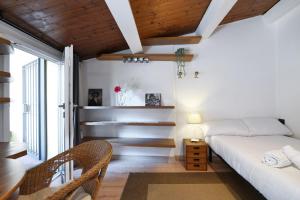 Кровать или кровати в номере Primopiano - Colonne 67